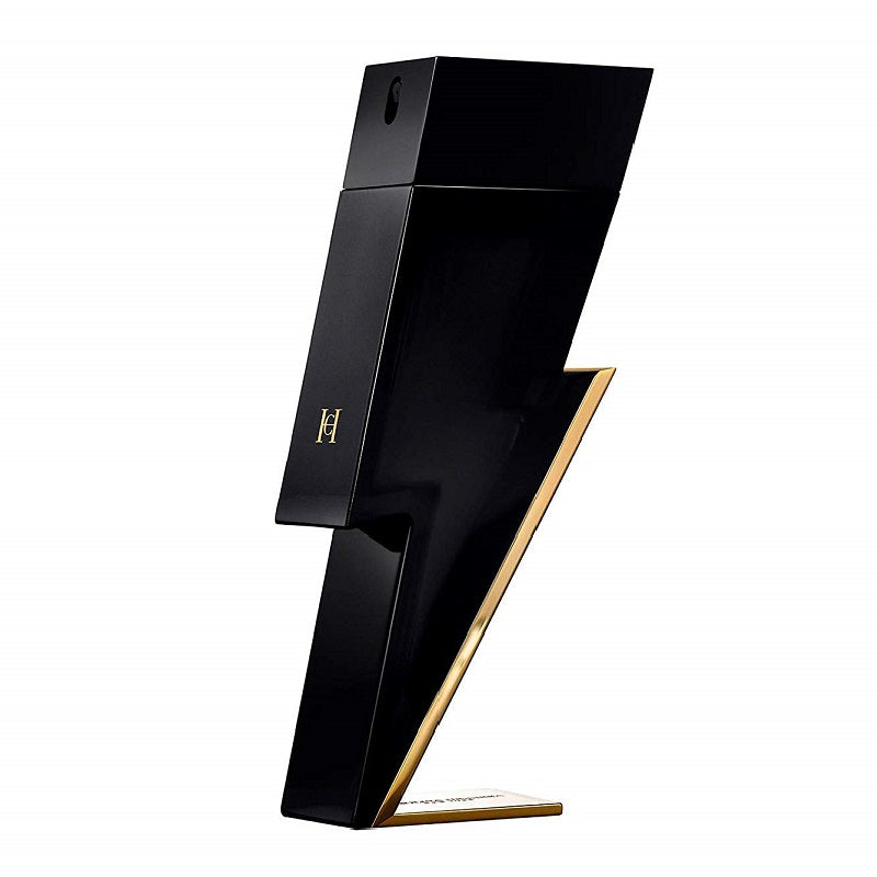 A black and gold bottle of Bad Boy Eau de Toilette by Carolina Herrera, designed in a striking lightning bolt shape.