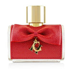 A bottle of CH Privée Women eau de parfum by Carolina Herrera with a red textured cap and a gold bow detail.