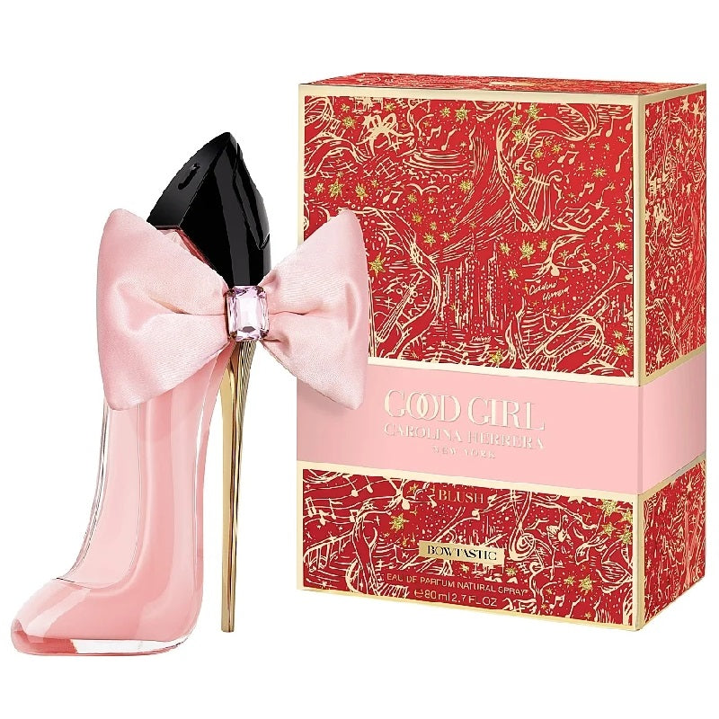 Pink high-heeled shoe-shaped perfume bottle with a bow and matching box on a white background