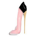Pink high-heeled shoe with a black and gold heel on a white background