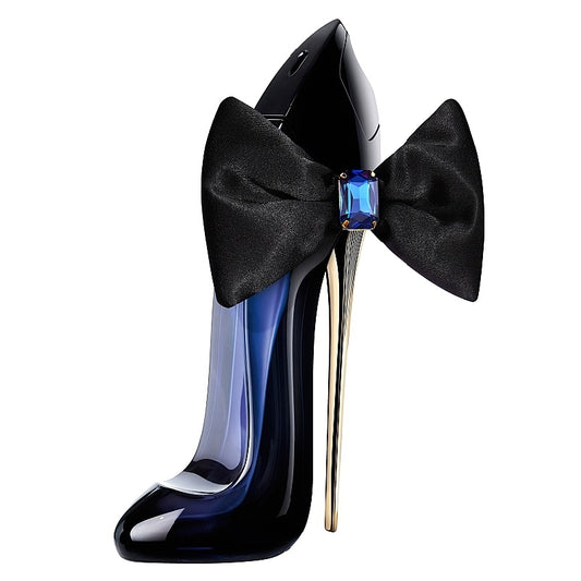 Black high-heeled shoe with a large black bow and blue gemstone on a white background