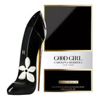 Carolina Herrera Good Girl Jasmine Absolue perfume bottle designed like a high-heeled shoe in glossy black with a white flower motif, shown next to its black and gold retail box on a white background.