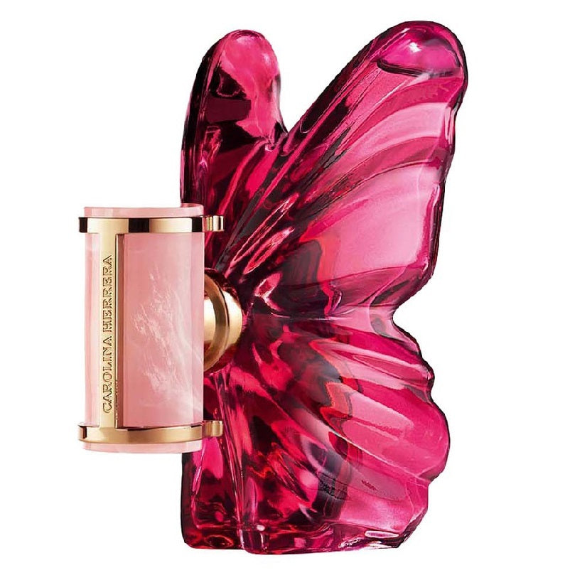 Pink butterfly-shaped perfume bottle with a smaller pink and gold bottle on a white background
