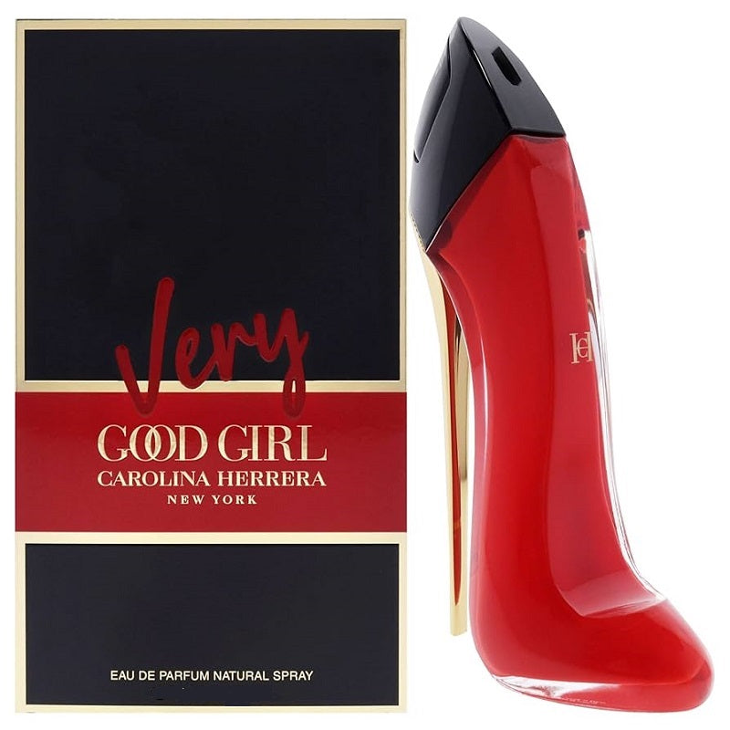 Red high-heeled shoe-shaped perfume bottle with 'Very Good Girl' packaging by Carolina Herrera on a white background.
