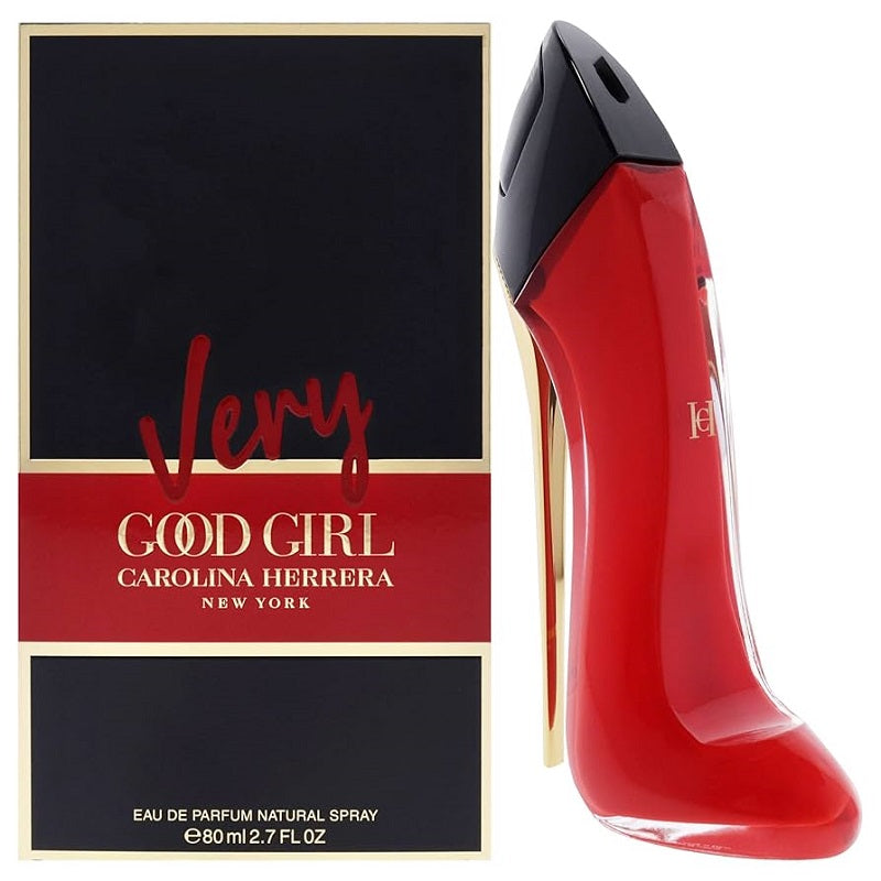 Red high-heeled shoe-shaped perfume bottle with 'Very Good Girl' packaging by Carolina Herrera on a white background.