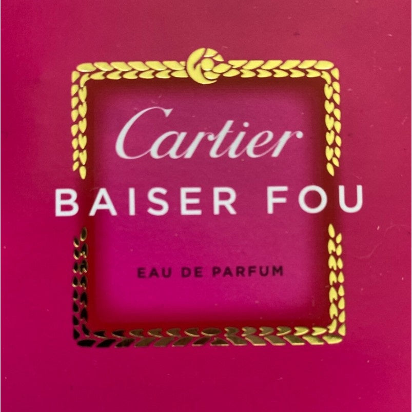 Cartier Baiser Fou perfume packaging on a pink background