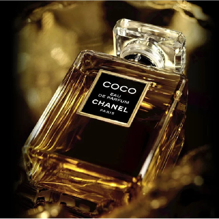 Chanel Coco perfume bottle on a dark background