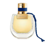 Perfume bottle with gold cap and blue ribbon on a white background