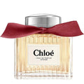 Chloe perfume bottle with a red ribbon on a white background