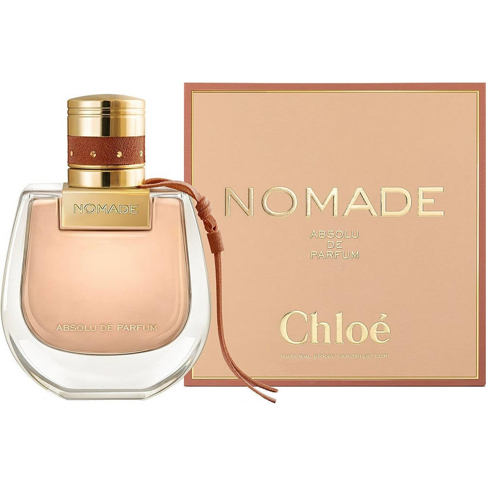 A product image featuring Nomade Absolu Eau De Parfum by Chloe in a glass bottle with a gold cap, alongside its packaging box.