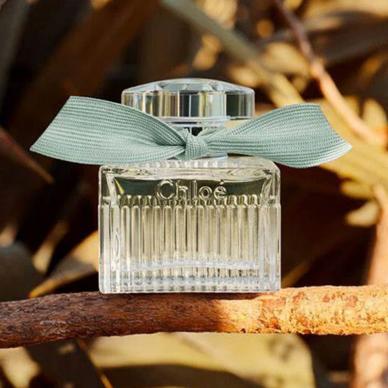 Chloe perfume bottle with a green ribbon on a branch