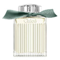 Chloe perfume bottle with a green ribbon on a white background
