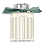Chloe perfume bottle with a green ribbon on a white background
