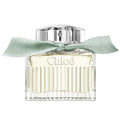 Chloe perfume bottle with a light green ribbon on a white background