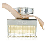 Chloe perfume bottle with a beige ribbon on a white background