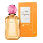 Chopard Happy Chopard Bigaradia eau de parfum bottle with a pink spherical cap next to its orange packaging box.