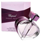 Chopard Happy Spirit Eau de Parfum bottle in front of its original packaging box. The heart-shaped clear glass bottle contains a light lavender liquid and features a metallic purple cap with a pink gemstone accent.