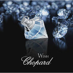 Chopard Wish diamond-shaped perfume bottle with diamonds on a dark background