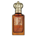 A bottle of Clive Christian E Gourmande Oriental Eau de Parfum with a brown tint and decorative design on the label.