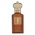 Clive Christian Private Collection Woody Floral with Vintage Rose perfume bottle, featuring an amber brown glass body, a gold ornate monogrammed label, and a detailed gold cap resembling a crown, set against a plain white background.