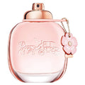 Coach Floral Eau de Parfum bottle with pink floral design and a pink charm on the cap.