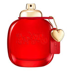 Red perfume bottle with gold cap and heart-shaped tag on a white background