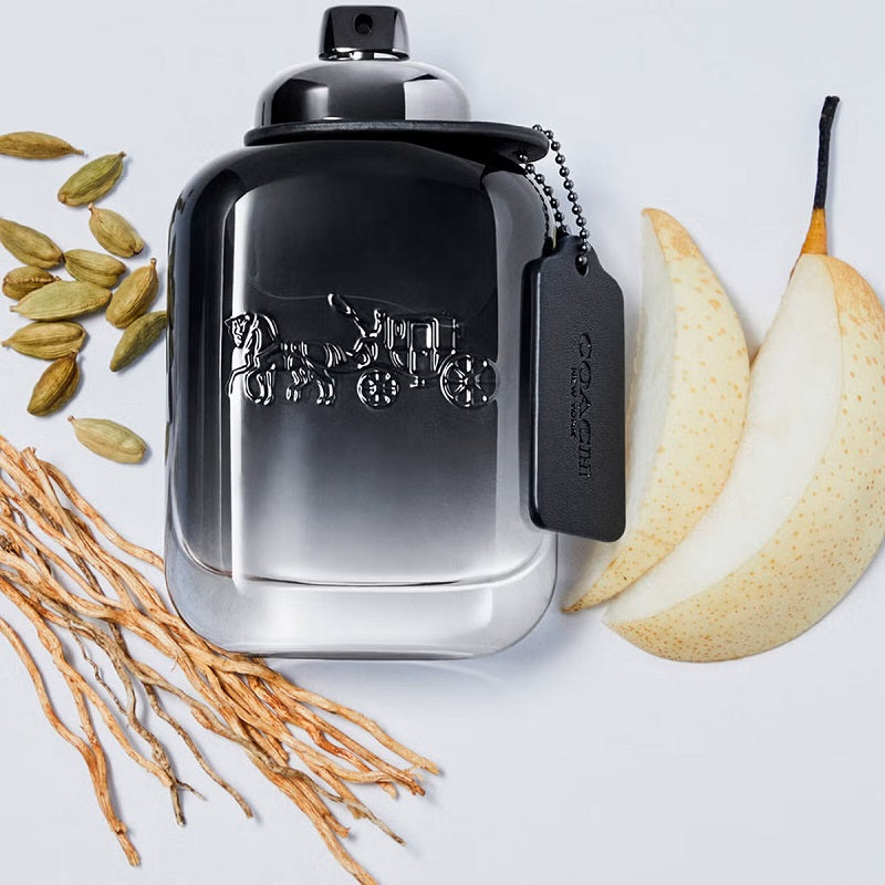 Coach cologne bottle with pear slices and cardamom seeds on a light background