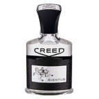 A bottle of Creed Aventus Eau de Parfum with a black cap and a label featuring a silver emblem of a horse and rider.