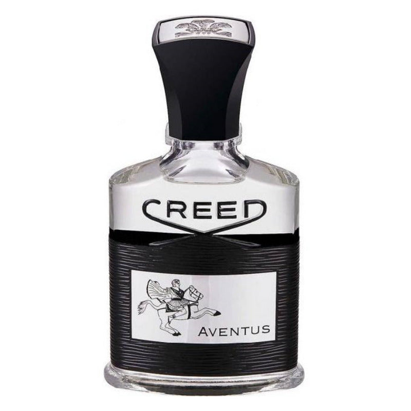 A bottle of Creed Aventus Eau de Parfum with a black cap and a label featuring a silver emblem of a horse and rider.