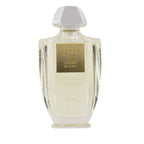 A clear glass bottle of Creed Cedre Blanc eau de parfum with a white cap and a label featuring the product name and brand.