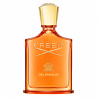 Creed Delphinus perfume bottle in amber glass with a gold cap, shown on a plain white background.