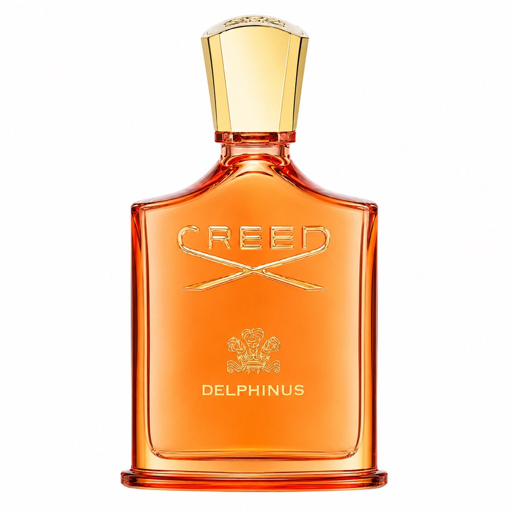 Creed Delphinus Eau de Toilette bottle in amber glass with a gold cap and gold lettering, shown on a plain white background.