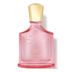 Pink Creed Eladaria perfume bottle with gold cap on a white background