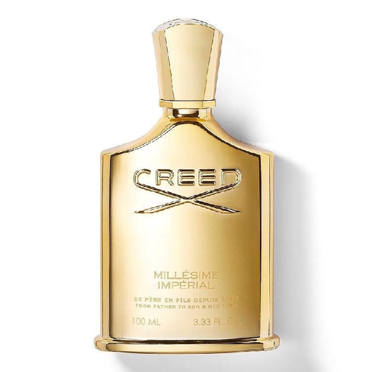 A bottle of Creed Millesime Imperial Eau de Parfum with a gold-colored label and cap, prominently displaying the brand logo.