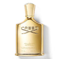 A bottle of Creed Millesime Imperial Eau de Parfum with a gold-colored label and cap, prominently displaying the brand logo.