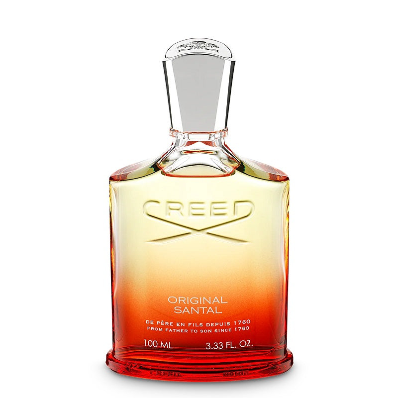 A bottle of Creed Original Santal Eau de Parfum with a gradient of yellow to red color at the base, transitioning to clear towards the top, with a white cap.