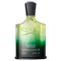 A green glass bottle of Creed Original Vetiver eau de parfum with a black cap and white label.