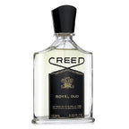 A bottle of Royal Oud Eau de Parfum by Creed with a black cap and a label that includes the product name and the brand name.