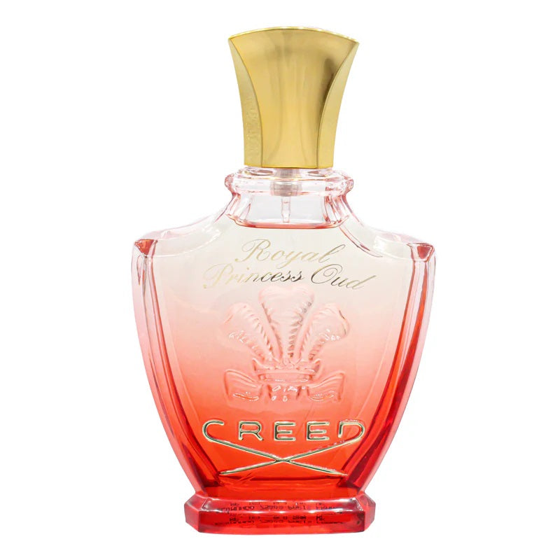 Creed perfume bottle with gold cap on a white background