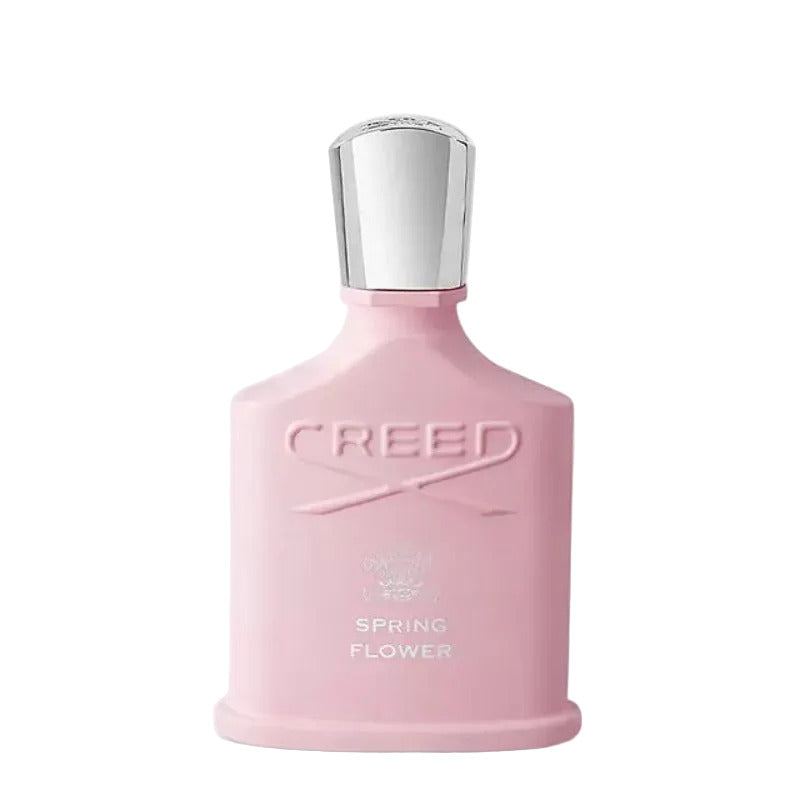 A pink bottle of Creed Spring Flower eau de parfum with a silver cap.