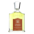 A bottle of Tabarome Millesime Eau de Parfum by Creed with a label in the center, predominantly in a clear glass bottle with a silver cap.