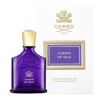 Creed Queen of Silk 30 ml perfume bottle next to matching amethyst and gold presentation box.