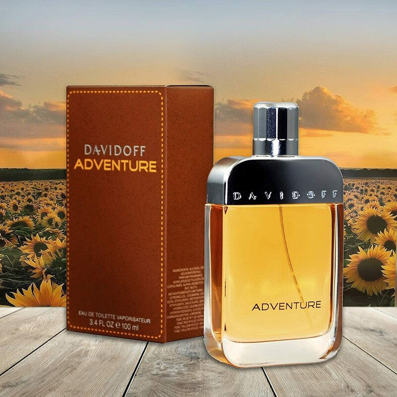 Davidoff Adventure perfume bottle and packaging with a sunflower field background