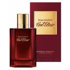 Davidoff Cool Elixir Safran Mineral perfume bottle in a deep red glass with a gold cap, shown next to its matching red and gold packaging box on a white background.