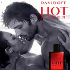 Advertisement for Davidoff Hot Water perfume featuring a couple embracing on a beach.