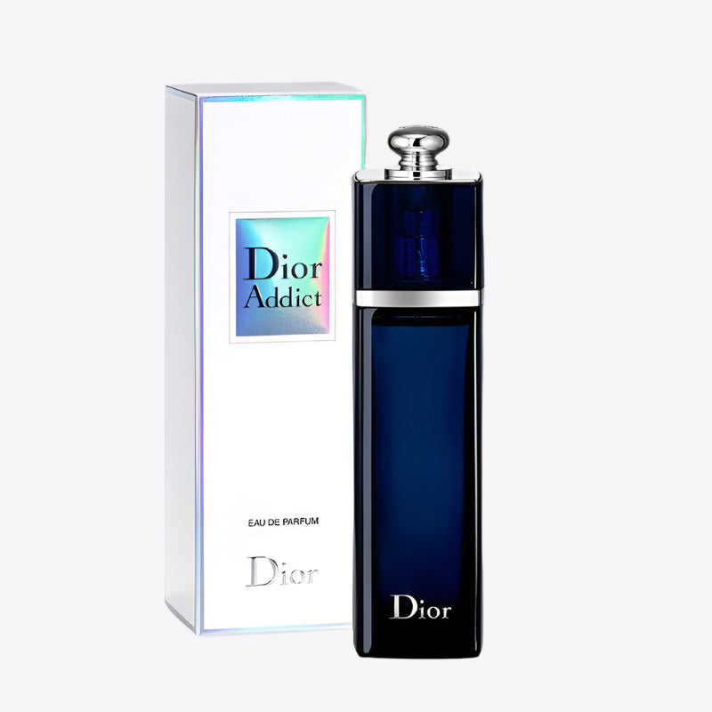A product image featuring a dark blue bottle of Dior Addict Eau de Parfum with silver details, alongside its packaging box.