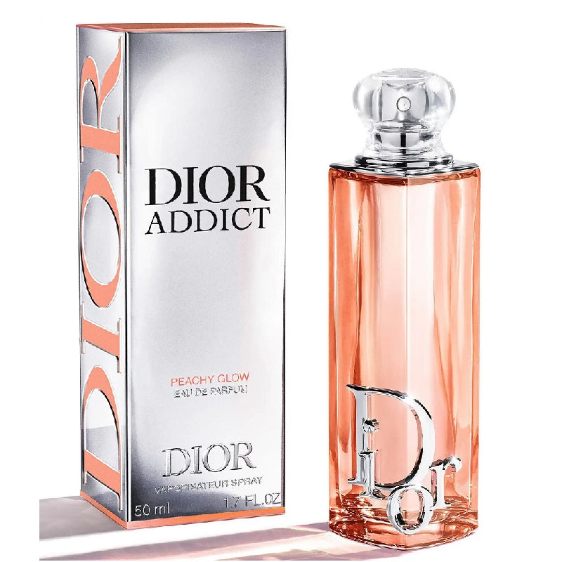 Dior Addict Peachy Glow perfume bottle and packaging on a white background