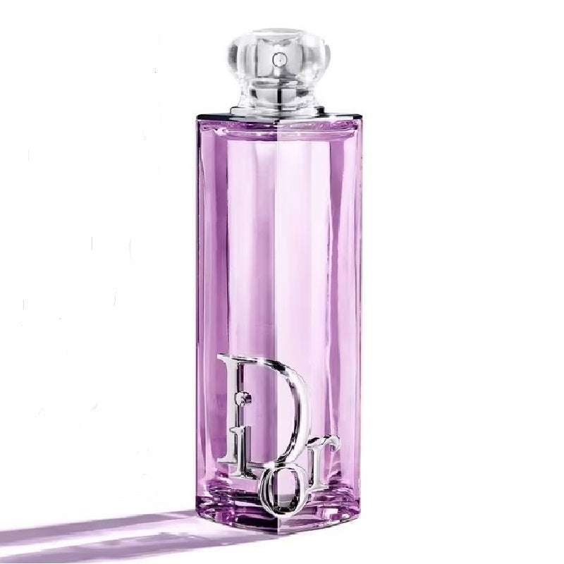 Pink perfume bottle with silver cap on a white background
