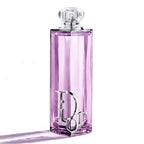 Pink perfume bottle with silver cap on a white background