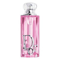 Pink Dior perfume bottle on a white background